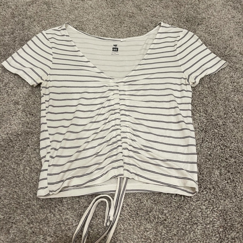 White top with horizontal black stripes